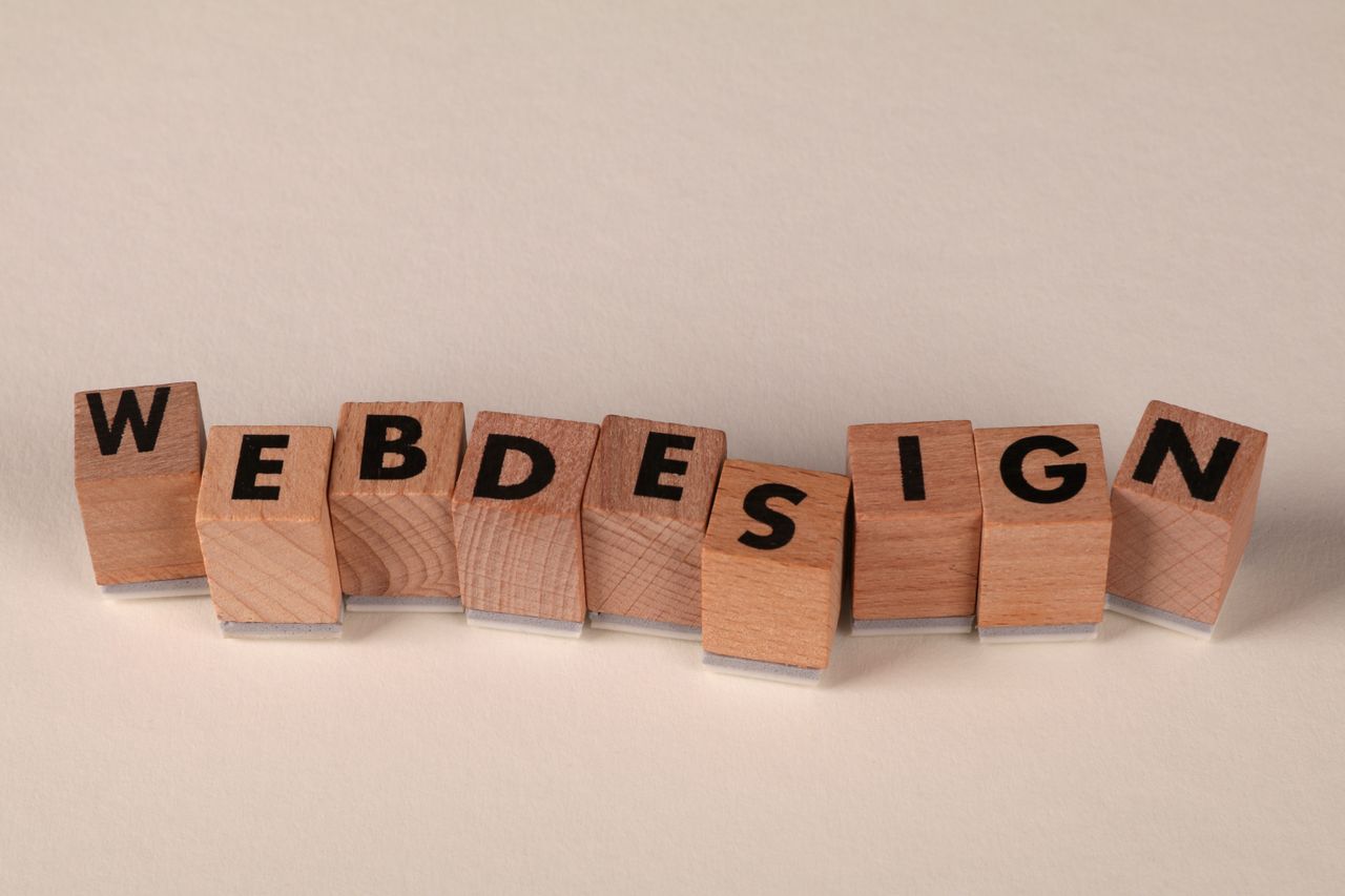 gallery-05 Wooden blocks spelling web design creatively showcase digital design concept.